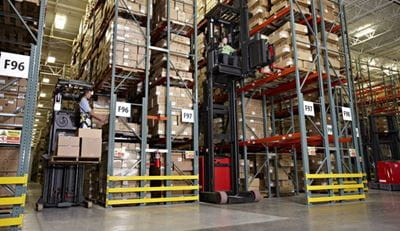 High capacity reach truck in operation in a warehouse Image shows a high capacity reach truck in operation in a warehouse