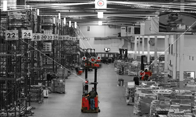 Raymond forklift in a warehouse with lines to forklift to demonstrate where the forklift is using the real-time location system.