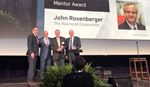 Image of John Rosenberger receiving award, accompanied by three other men