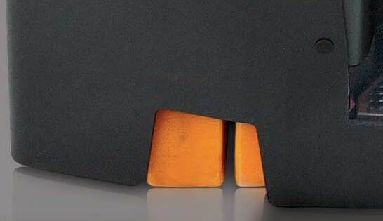 Close-up of Raymond stand-up forklift base showing dual steer wheel design.