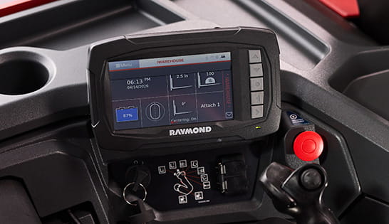 Close-up of Raymond stand-up counterbalanced forklift control panel with full-color 7-inch touchscreen display.