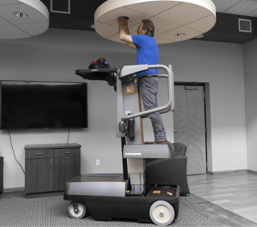 Raymond Basics Sprint, man working on a personnel lift
