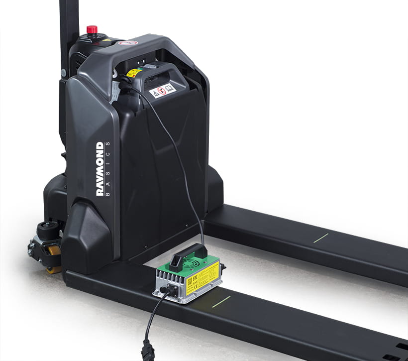 Raymond Basics electric pallet jack with onboard charger connected to battery system